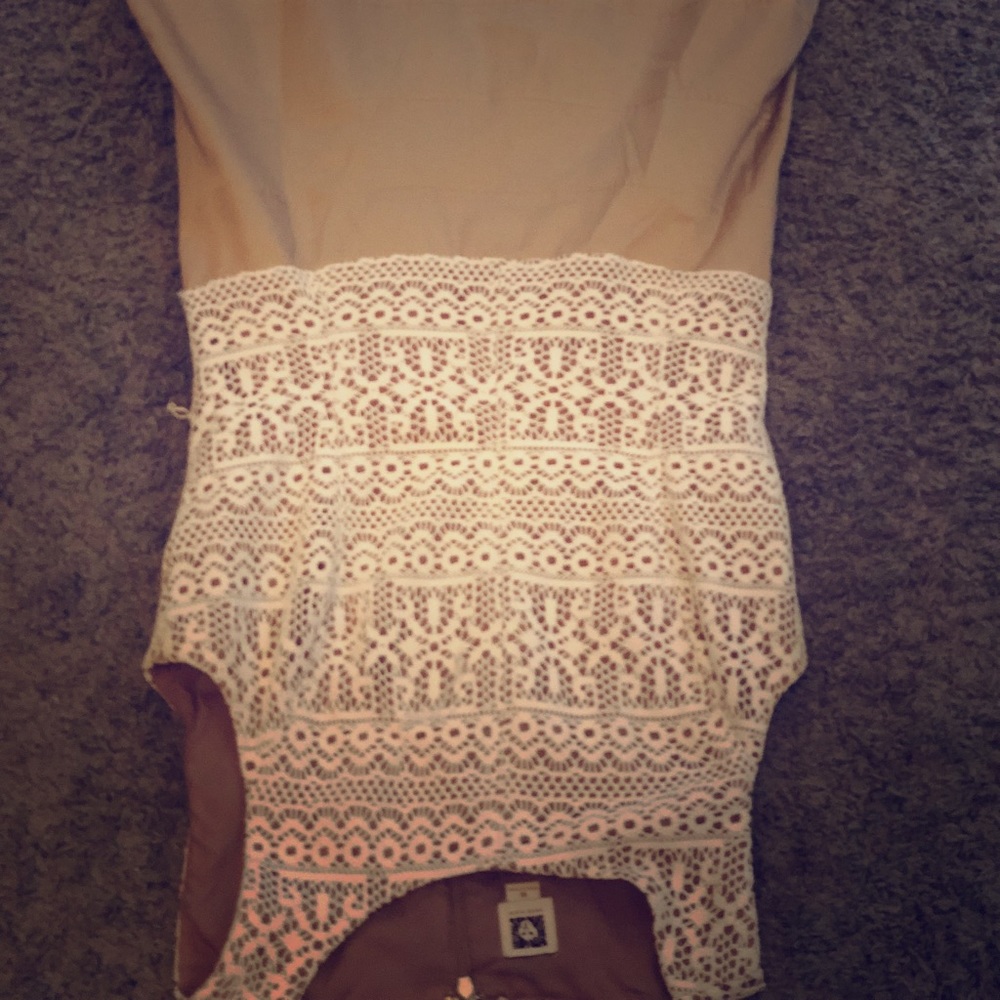 This khaki colored dress with off white accents